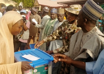 One of the beneficiaries receiving the Food Care Pack from the Representative of Chief of Army Staff, Lt. Janet Obolo in Wase on Thursday
