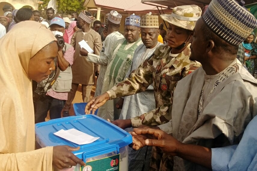 One of the beneficiaries receiving the Food Care Pack from the Representative of Chief of Army Staff, Lt. Janet Obolo in Wase on Thursday