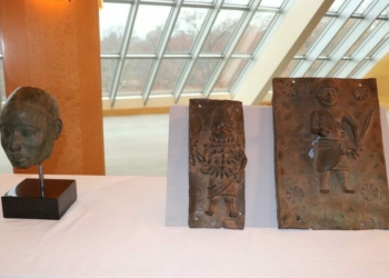 A 14th-century Ife brass head and two 16th-century Benin brass plaques at the official handing-over by Metropolitan Museum of Arts, New York to Representatives of the Nigerian Government