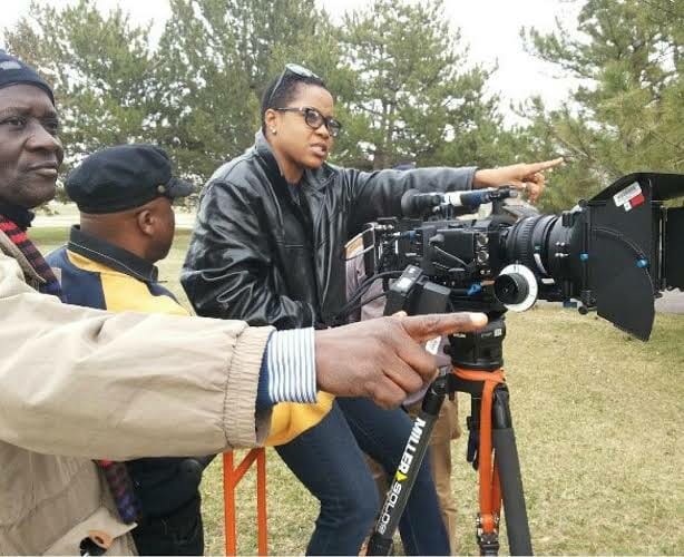 Movie director, Tope Oshin on a movie set.