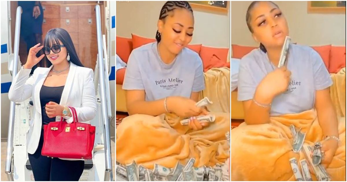 Regina Daniels sits amid dollars as she shows off money tree she received from mother -VIDEO
