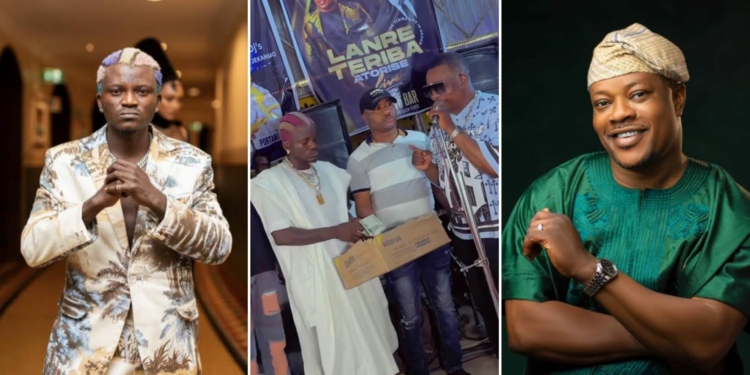 Portable makes money rain on gospel singer Lanre Teriba at odogwu bar [VIDEO]