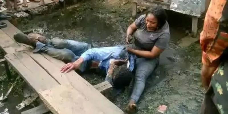 A woman said to be the deceased's mother is seen beating the suspect