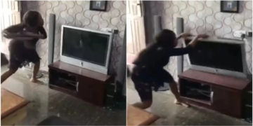 Nigerian lady destroys boyfriend's TV in anger over alleged affair