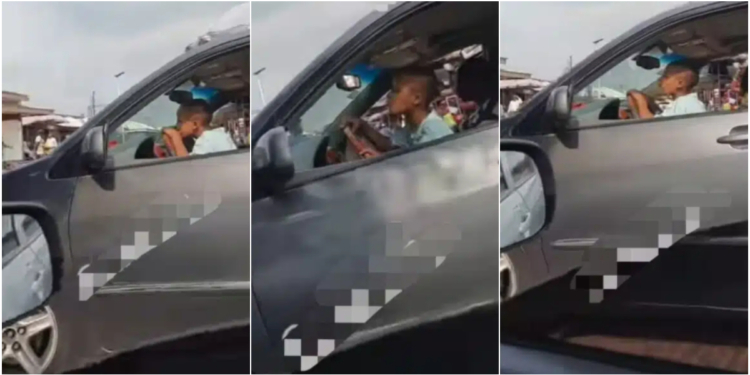 Video emerges of little child expertly steering a car in busy Abuja Market