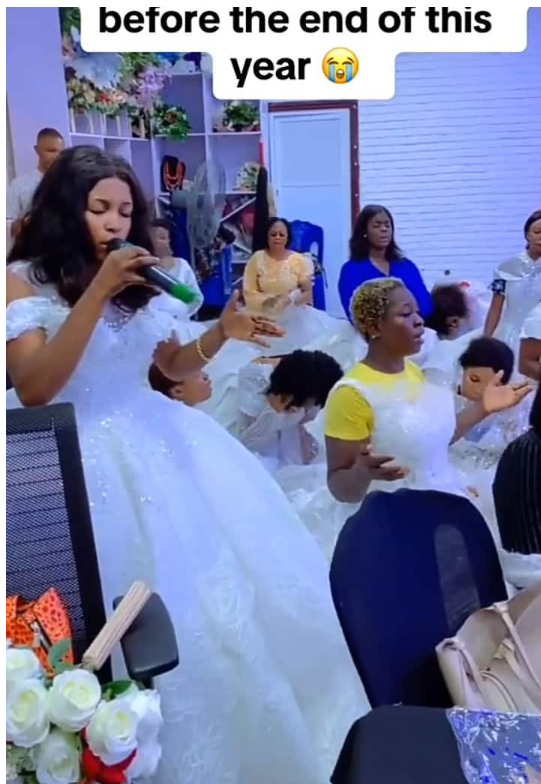 Nigerian single ladies wear wedding gowns to church in prayer for husbands