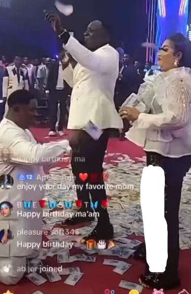 Church members make it rain money on pastor's wife's birthday during church service