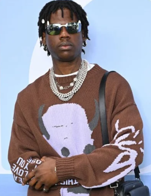 fan celebrates Rema’s new album release '''HEIS' with permanent tattoo