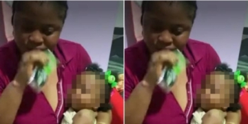 Woman feeding baby action bitters