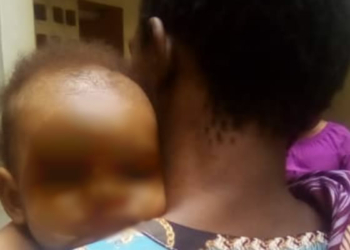 Suspect, Victoria Chekwube, holding her baby