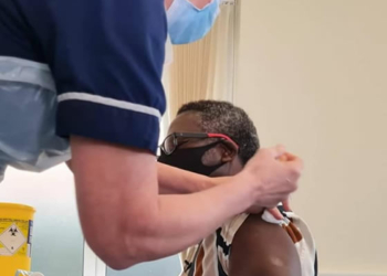 Pastor Matthew Ashimolowo receiving COVID-19 vaccine