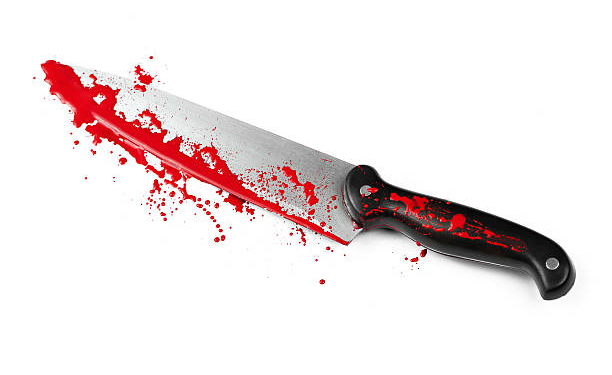 A blood covered knife isolated on white.