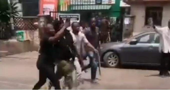 Accused police officer being chased by mob