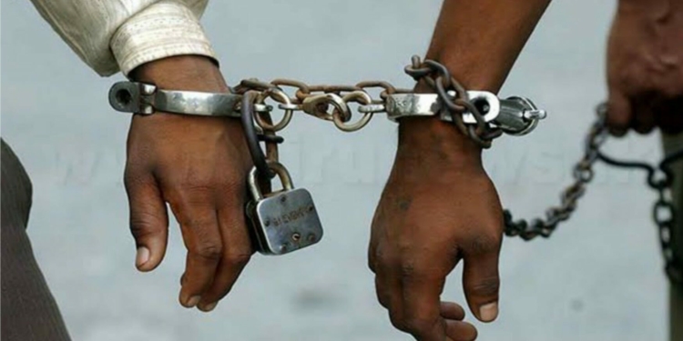 File Image: Two suspected criminals in handcuff