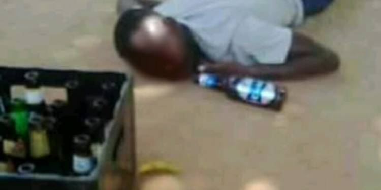 Depict image: A drunk man lying on the floor