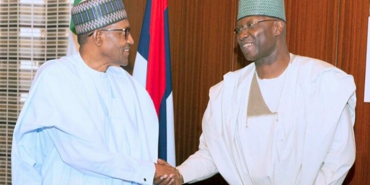 President Muhammadu Buhari in a handshake with the SGF Mr. Boss Mustapha during an audience with Founder of Dana Air the State House, Abuja. PHOTO; SUNDAY AGHAEZE. JULY 3 2019.