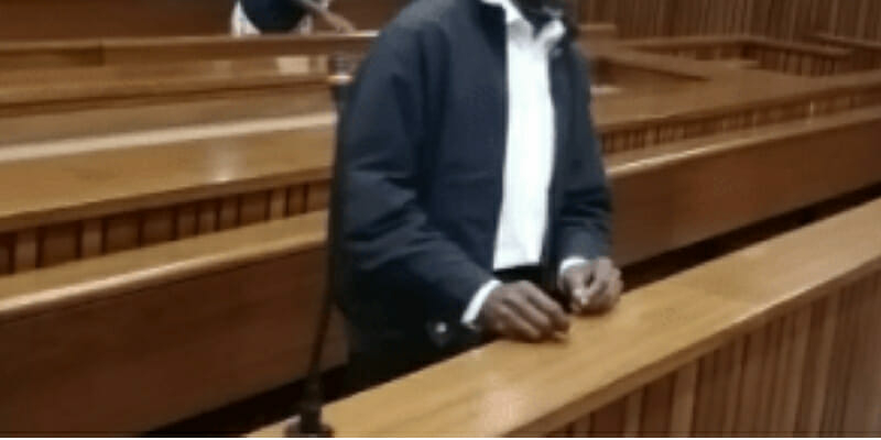 DEPICT: filed photo of a man in court