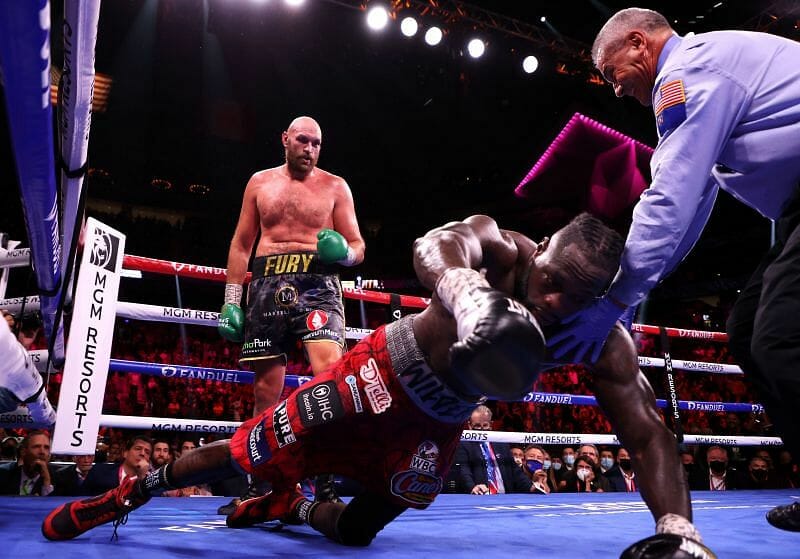 Deontay Wilder reacts to getting knocked out by Tyson Fury in trilogy fight