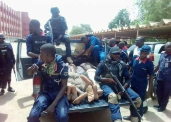 Depict image - NSCDC officers and suspects