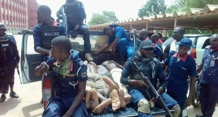 Depict image - NSCDC officers and suspects