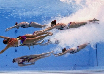 Members of Team Canada are seen underwater as they perform in the synchronised swimming team free routine preliminary at the Aquatics World Championships. REUTERS/Michael Dalder