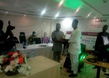 L-R NUJ National President, Chief Chris Isiguzo presenting the CRAN Patron investiture plaque to Gov. Yayaha Bello represented by his Special Adviser on Security, Cdr. Jerry Omodara on Sunday in Lagos (NAN)