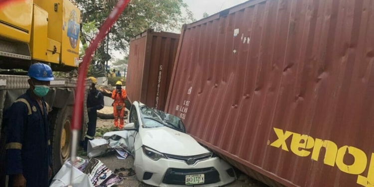 container falls on car