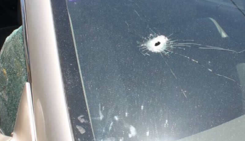 Windscreen of a car shot during attack