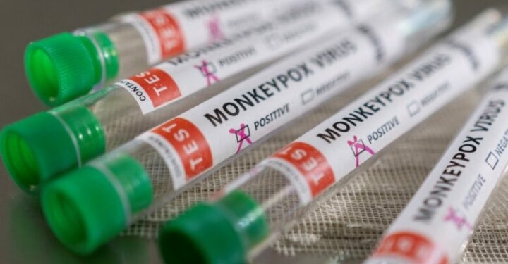 Test tubes labelled "Monkeypox virus positive" are seen in this illustration taken May 22, 2022. REUTERS/Dado Ruvic/Illustration