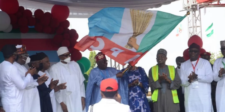 Buhari presents APC Victory Flag to Tinubu