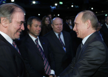 File - In this Dec. 2, 2010 file photo, then Russian Prime Minister Vladimir Putin, right, congratulates members of the Russian delegation, from left: conductor Valery Gergiyev, businessman Roman Abramovich and Nizhny Novgorod governor Valery Shantsev; after it was announced that Russia would host the 2018 soccer World Cup, in Zurich, Switzerland. The sudden immigration to Israel of billionaire Abramovich makes him the latest in a string of Jewish Russian oligarchs who have made a home in the country in recent years. Abramovich, who has an estimated net worth of more than $11 billion, received Israeli citizenship upon arrival Monday, May 28, 2018. The Chelsea football club owner made the move after his British visa was not renewed, apparently as part of British efforts to crack down on associates of Putin. (AP Photo/Alexei Nikolsky, Pool, File)