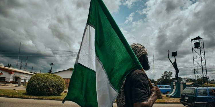 Port Harcourt, Nigeria - October 20, 2020: Protesters walking around the city of Port Harcourt with placards and sign for the #Endsars protests in Nigeria, and the country's flag.
Crdt: Emmanuel Ikwuegbu
