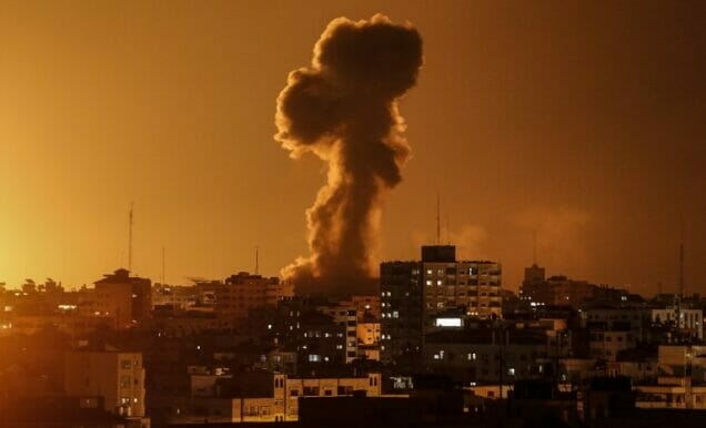 A picture taken on November 12, 2018, shows smoke rising above the building housing the Hamas-run television station al-Aqsa TV in the Gaza Strip during an Israeli air strike. - Israel's military said it was carrying out air strikes "throughout the Gaza Strip" after rocket fire from the Palestinian enclave towards its territory. (Photo by Mahmud Hams / AFP)