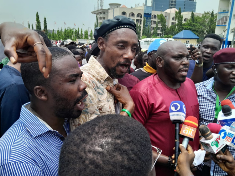 BREAKING: Pro-Tinubu groups storm Abuja streets, protest against interim govt