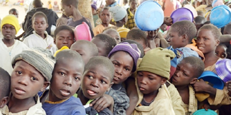 Young Almajiri boys wait in line for food in northern Nigeria