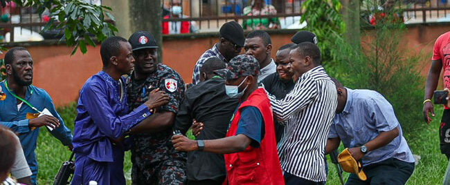 A file image of security operatives arresting a suspected vote buyer during an election