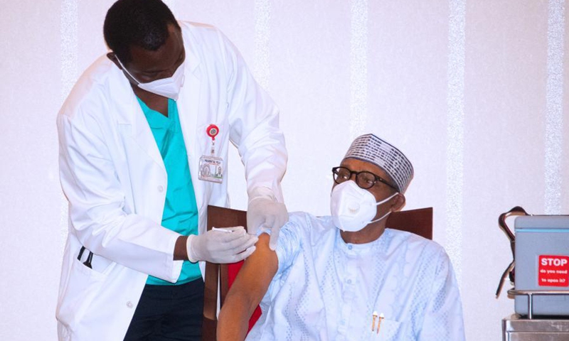 Nigerian President Muhammadu Buhari receives a dose of COVID-19 vaccine in Abuja, Nigeria, on March 6, 2021.