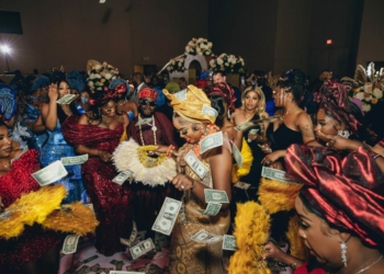 Why do Nigerians spray money at events?