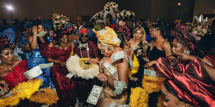 Why do Nigerians spray money at events?