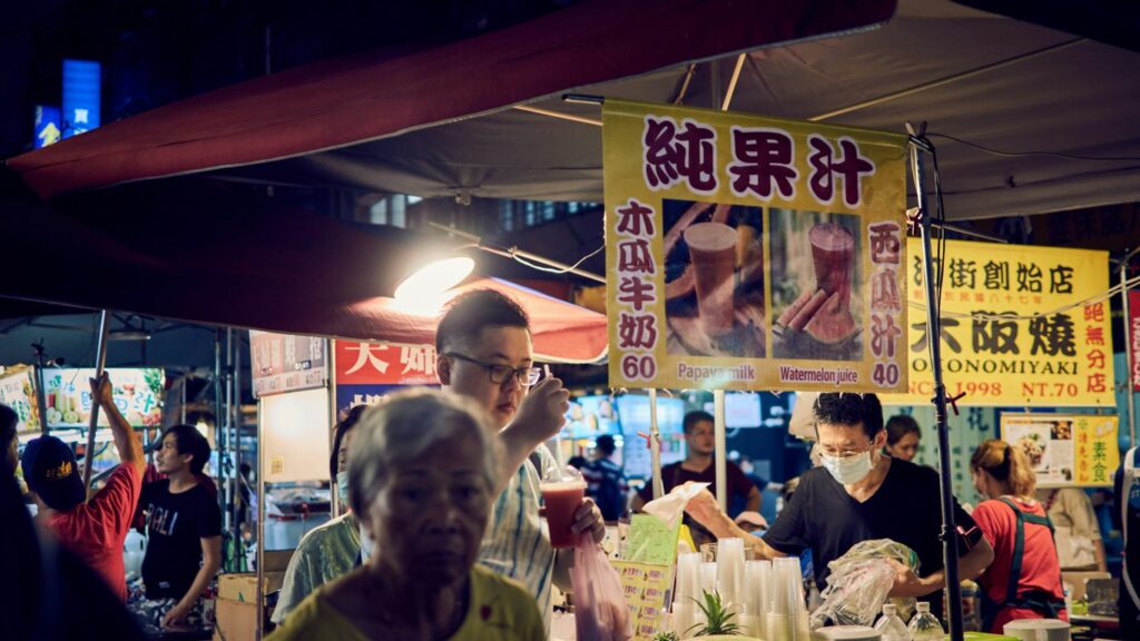 man in yellow crew neck shirt standing beside woman in white crew neck shirt