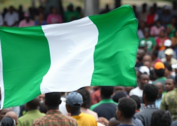 Nigerian flag and hopeful citizens