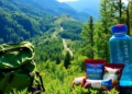Hiker's food and gear on a mountain trail.