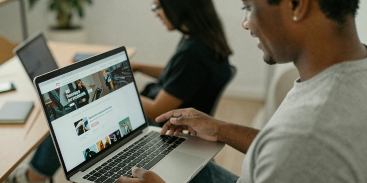 Person testing a website on a laptop.
