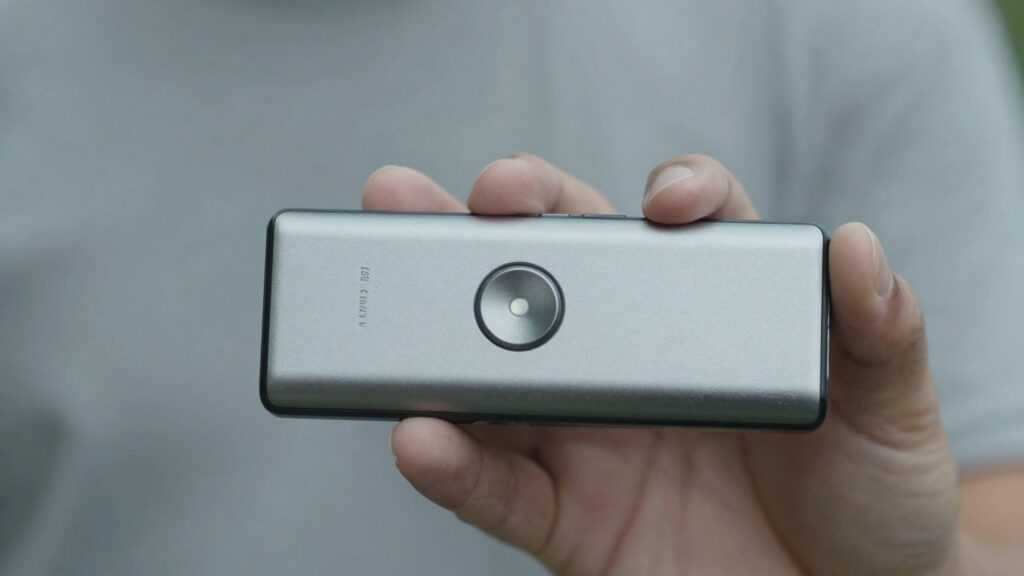 Person holding a personal safety alarm device.