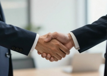 Business handshake sealing a contract agreement.