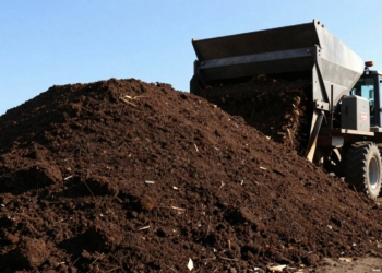 Industrial compost pile with machinery