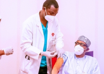 Nigerian President Muhammadu Buhari receives a dose of COVID-19 vaccine in Abuja, Nigeria, on March 6, 2021.