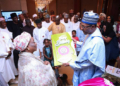 Maryam Abacha presenting President Buhari a birthday card