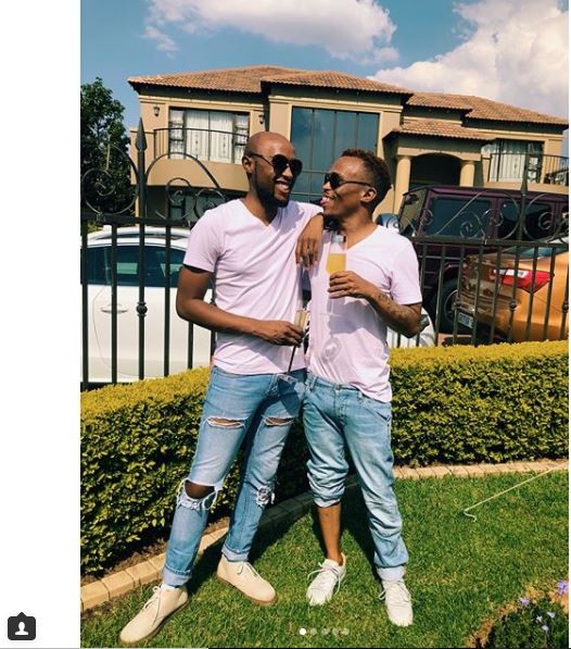 South African gay media personality, ?Somizi shows off his man as they step out in matching outfits (Photos)