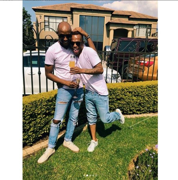 South African gay media personality, ?Somizi shows off his man as they step out in matching outfits (Photos)